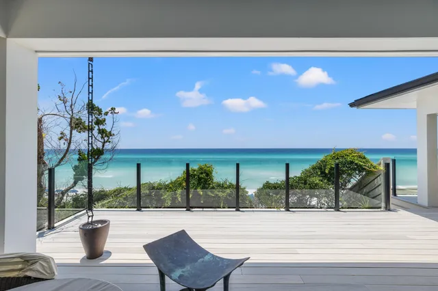 a kitchen with stainless steel appliances granite countertop a table chairs stove and cabinets
