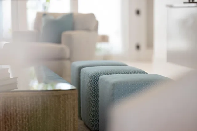 a bathroom with a mirror and a wooden floor