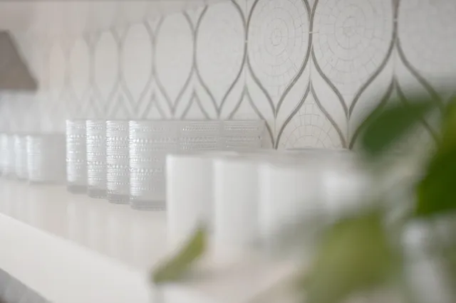 a spacious bedroom with a large bed and a flat screen tv