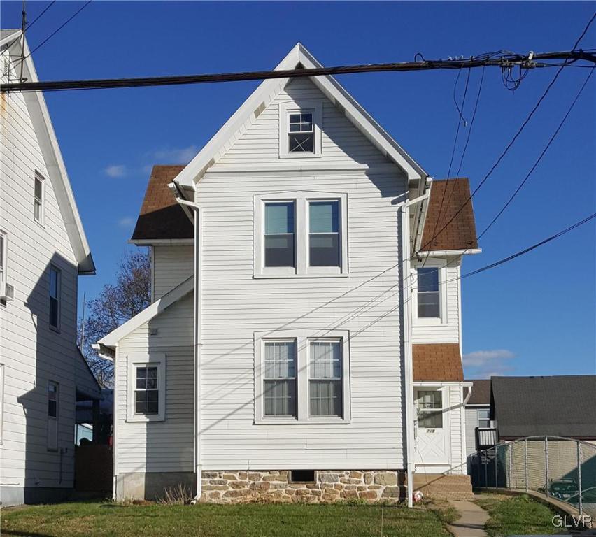 719 Front Street, Unit 2 Hellertown, PA 18055 - Photo 1 of 8 a view of a house with brick walls