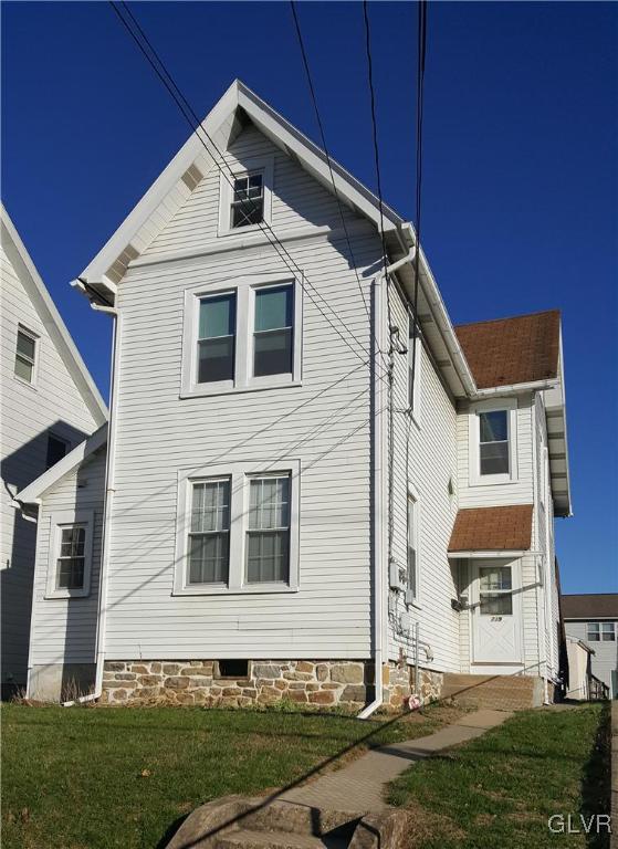 719 Front Street, Unit 2 Hellertown, PA 18055 - Photo 2 of 8 a front view of a house with a yard
