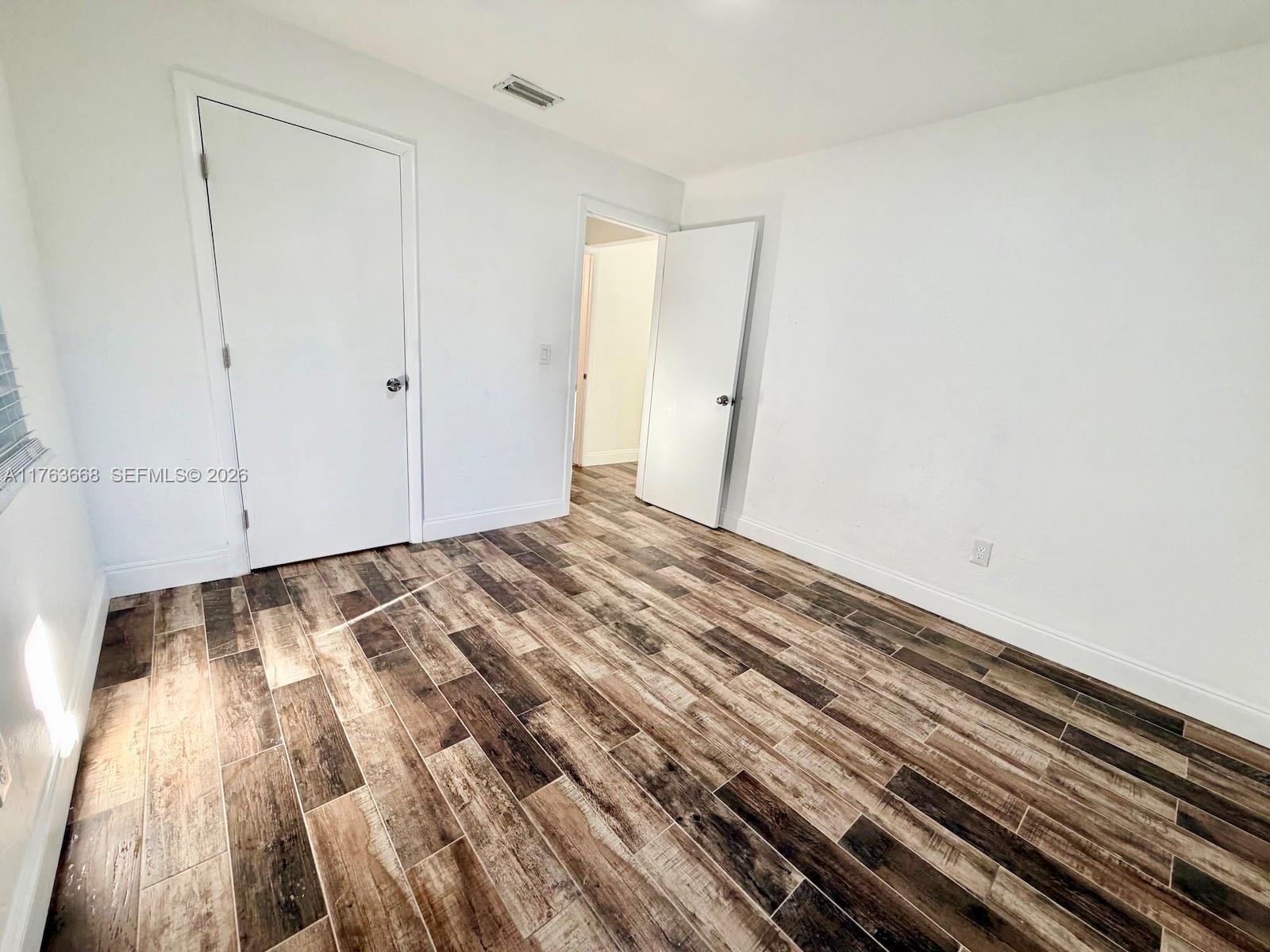 929 Southwest 12th Avenue Miami, FL 33130 - Photo 11 of 38 a view of a room with wooden floor