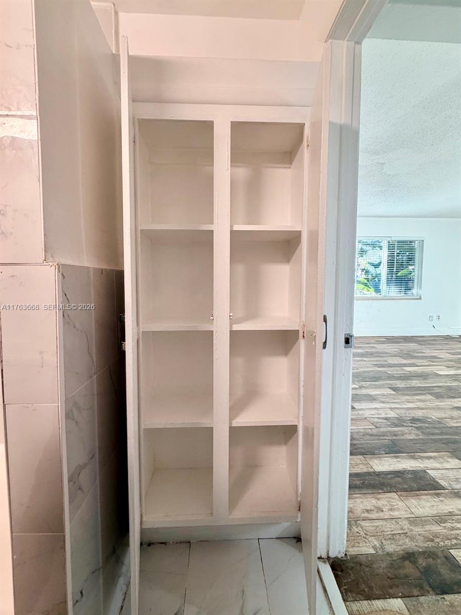 929 Southwest 12th Avenue Miami, FL 33130 - Photo 13 of 38 a view of closet area with empty racks
