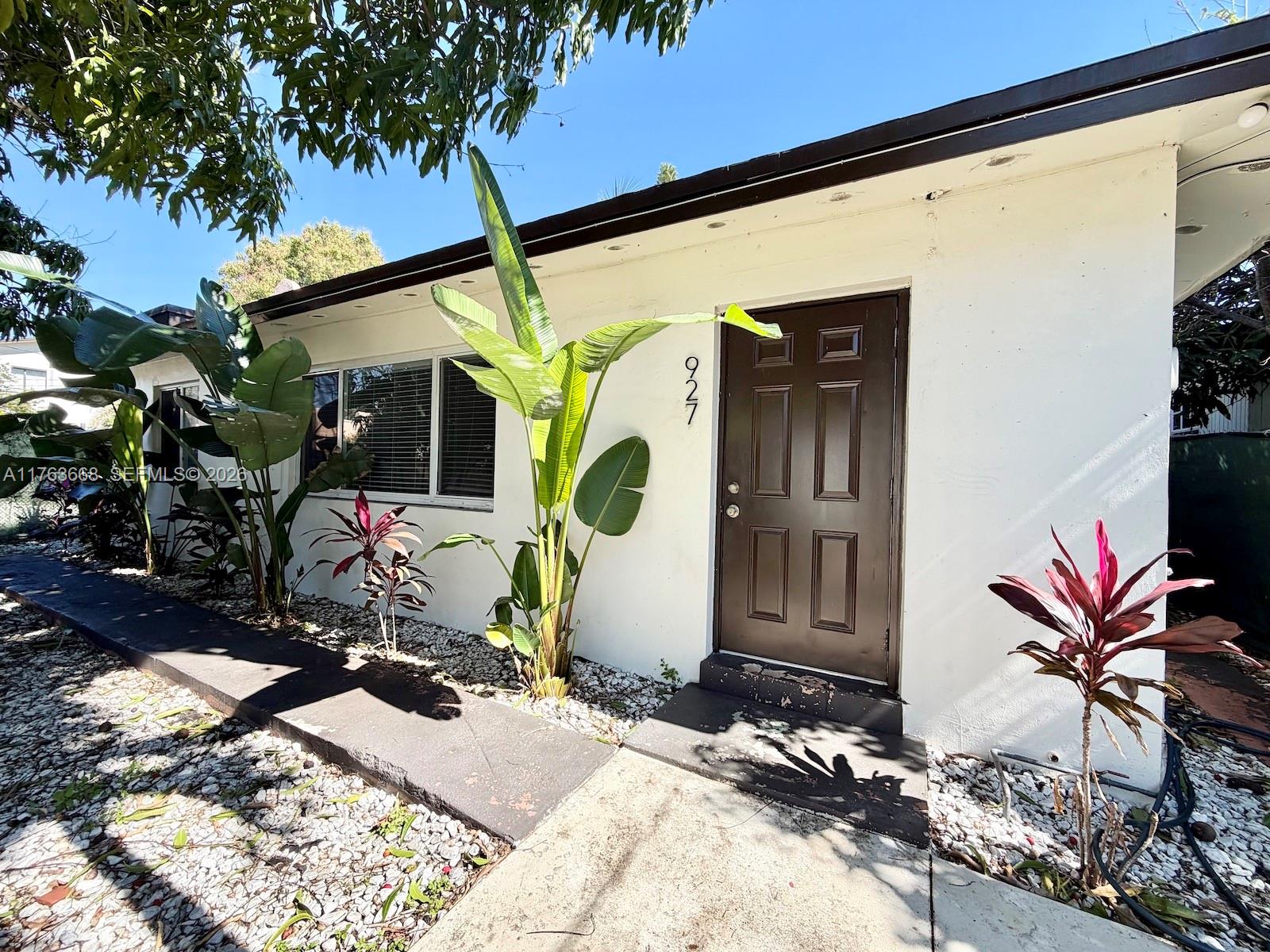 929 Southwest 12th Avenue Miami, FL 33130 - Photo 2 of 38 a front view of a house with backyard