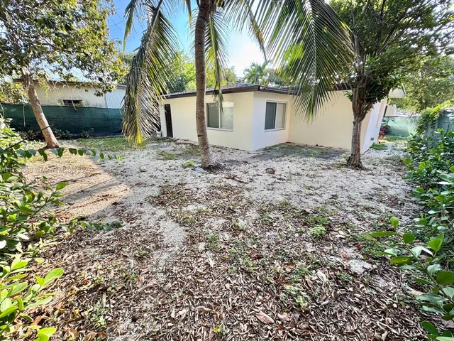 a backyard of a house with seating space