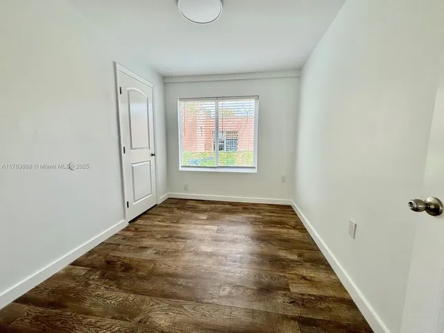 a view of an empty room and window