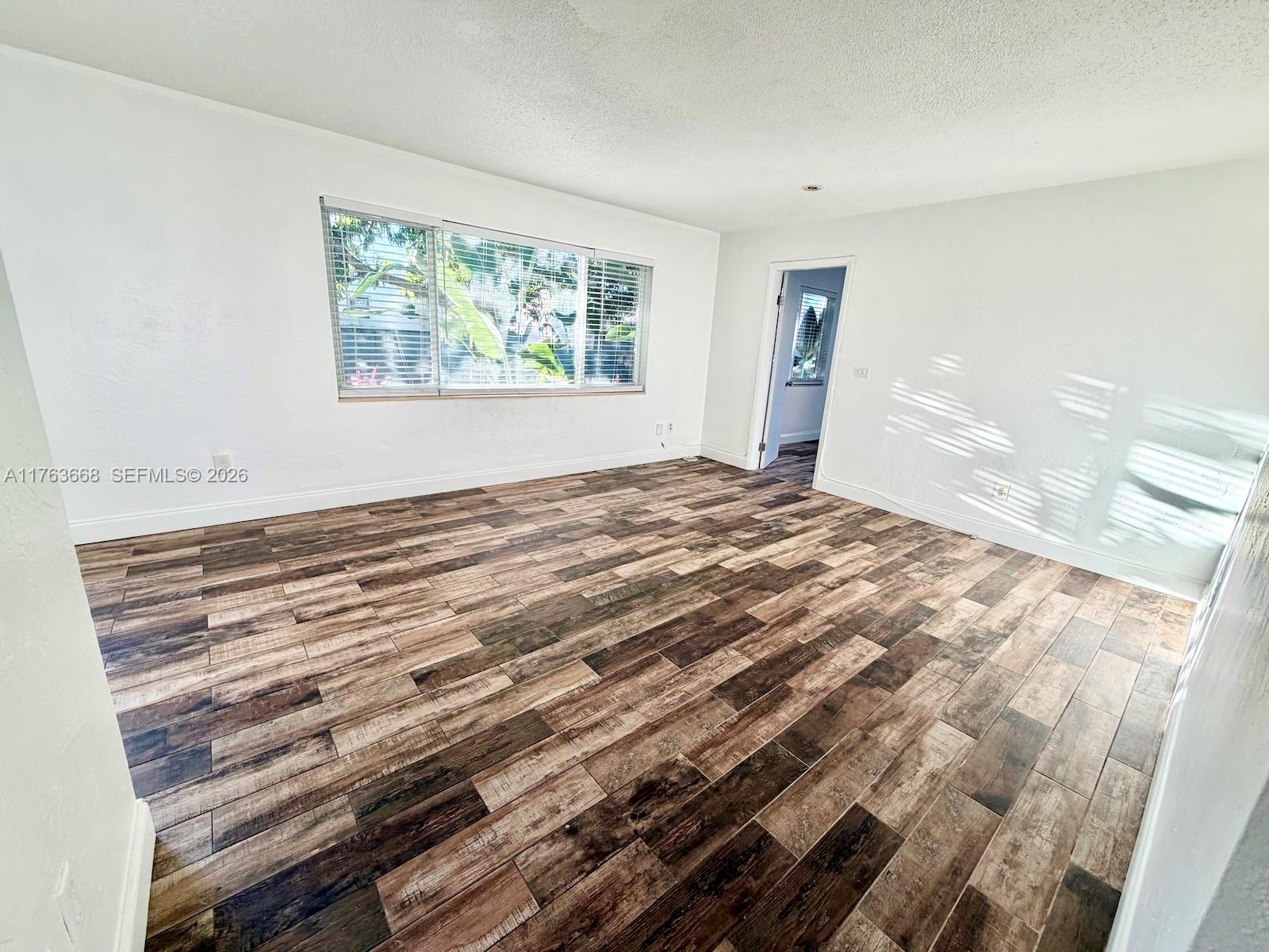 929 Southwest 12th Avenue Miami, FL 33130 - Photo 8 of 38 a view of empty room with wooden floor