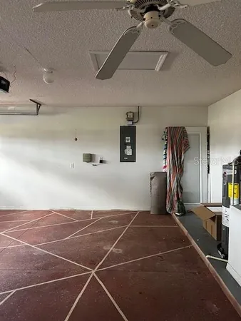 a room with gym equipment and windows