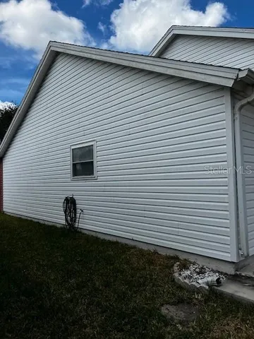 a view of a back yard of a house