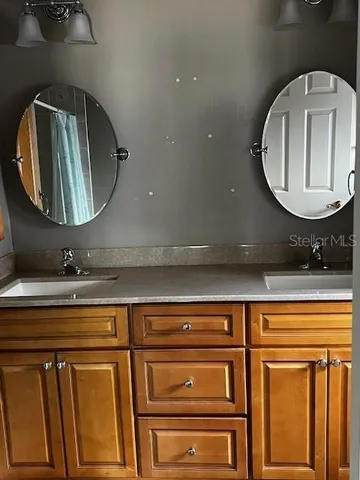 a bathroom with a sink and a mirror