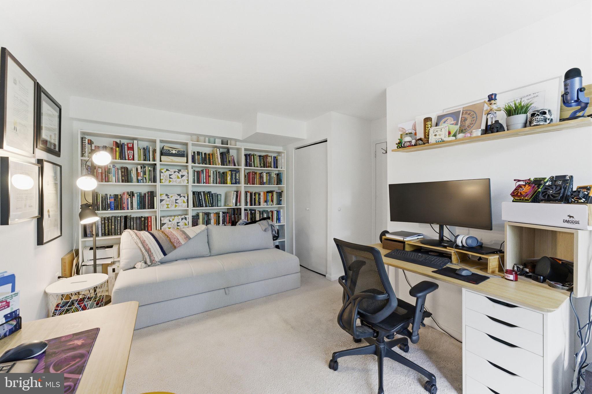 11260 Chestnut Grove Square, Unit 337 Reston, VA 20190 - Photo 36 of 82 Cozy workspace with a book-filled wall.