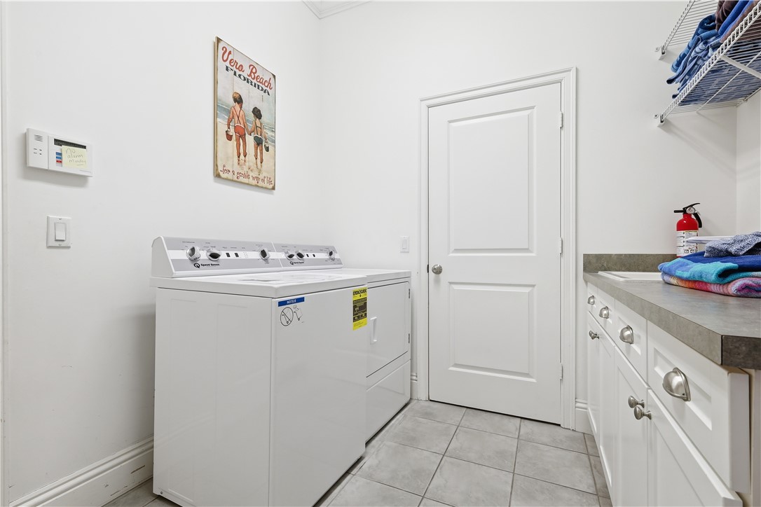2116 Cavalla Road Vero Beach, FL 32963 - Photo 16 of 23 a utility room with washer and dryer