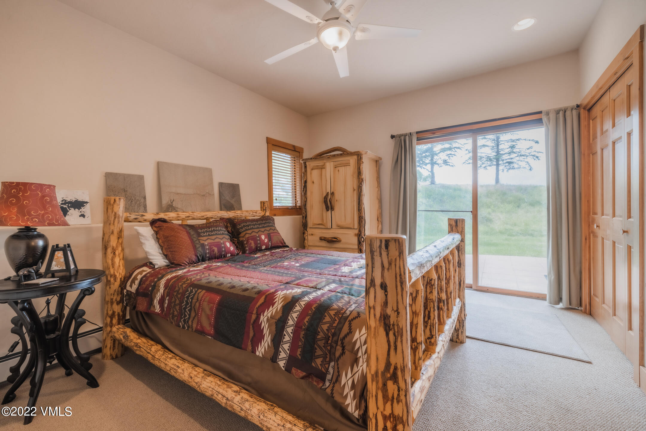 53 Knudson Ranch Road Edwards, CO 81632 - Photo 12 of 19 a bed room with a bed and a chandelier