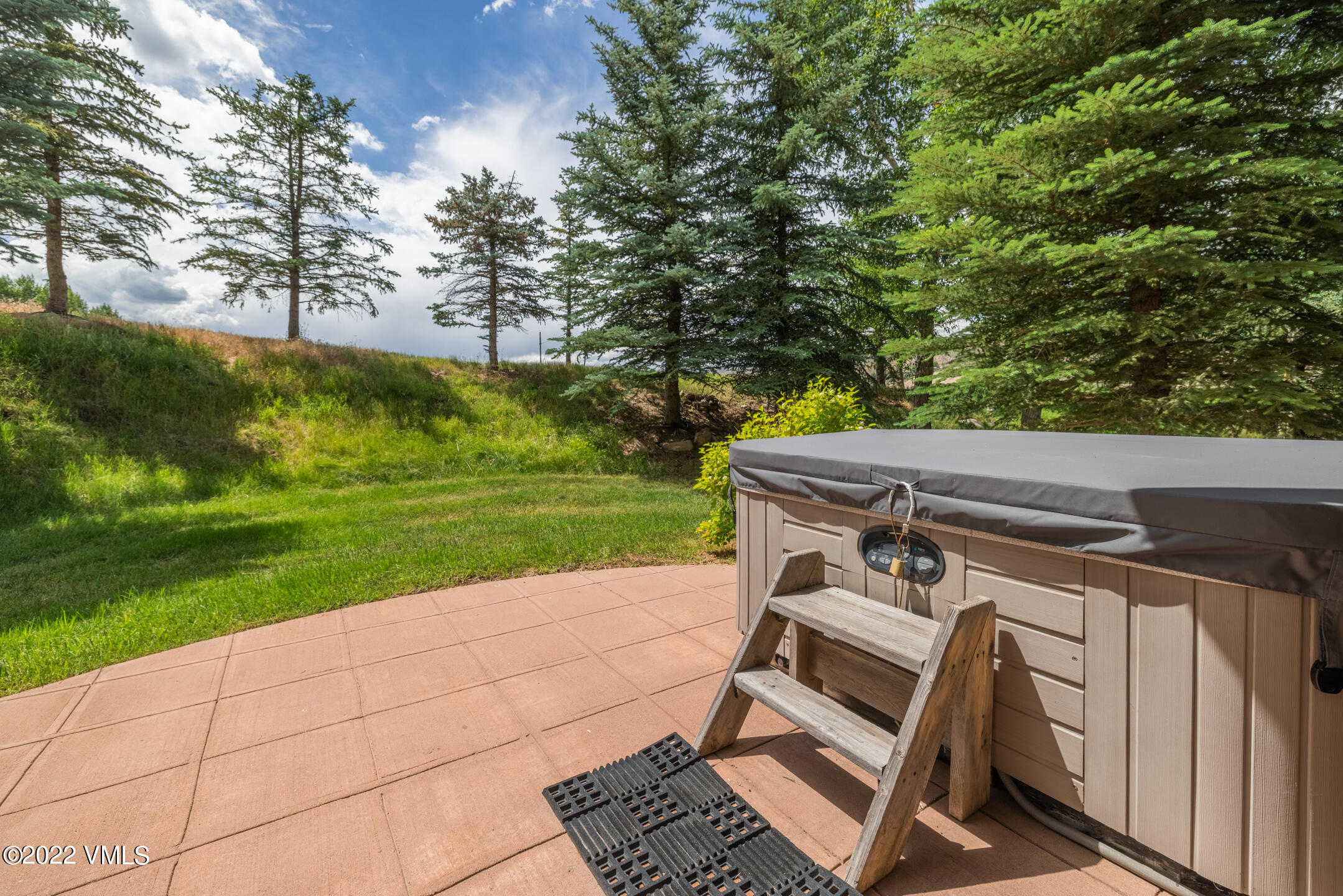 53 Knudson Ranch Road Edwards, CO 81632 - Photo 16 of 19 a view of a patio with a yard