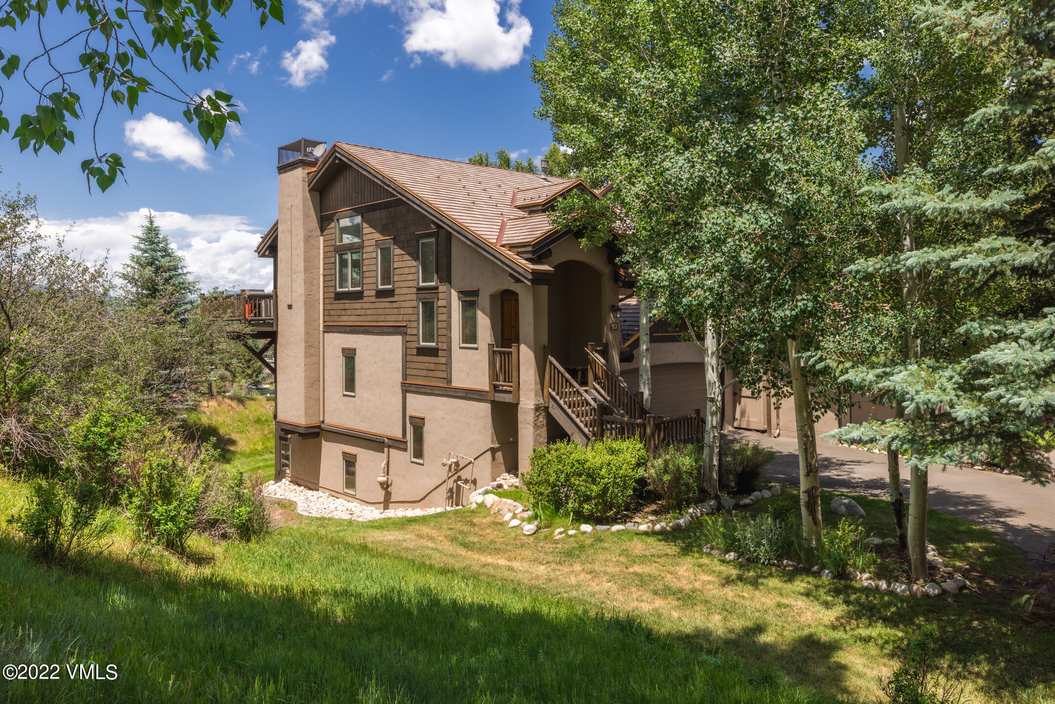 53 Knudson Ranch Road Edwards, CO 81632 - Photo 4 of 19 a view of a house with a yard