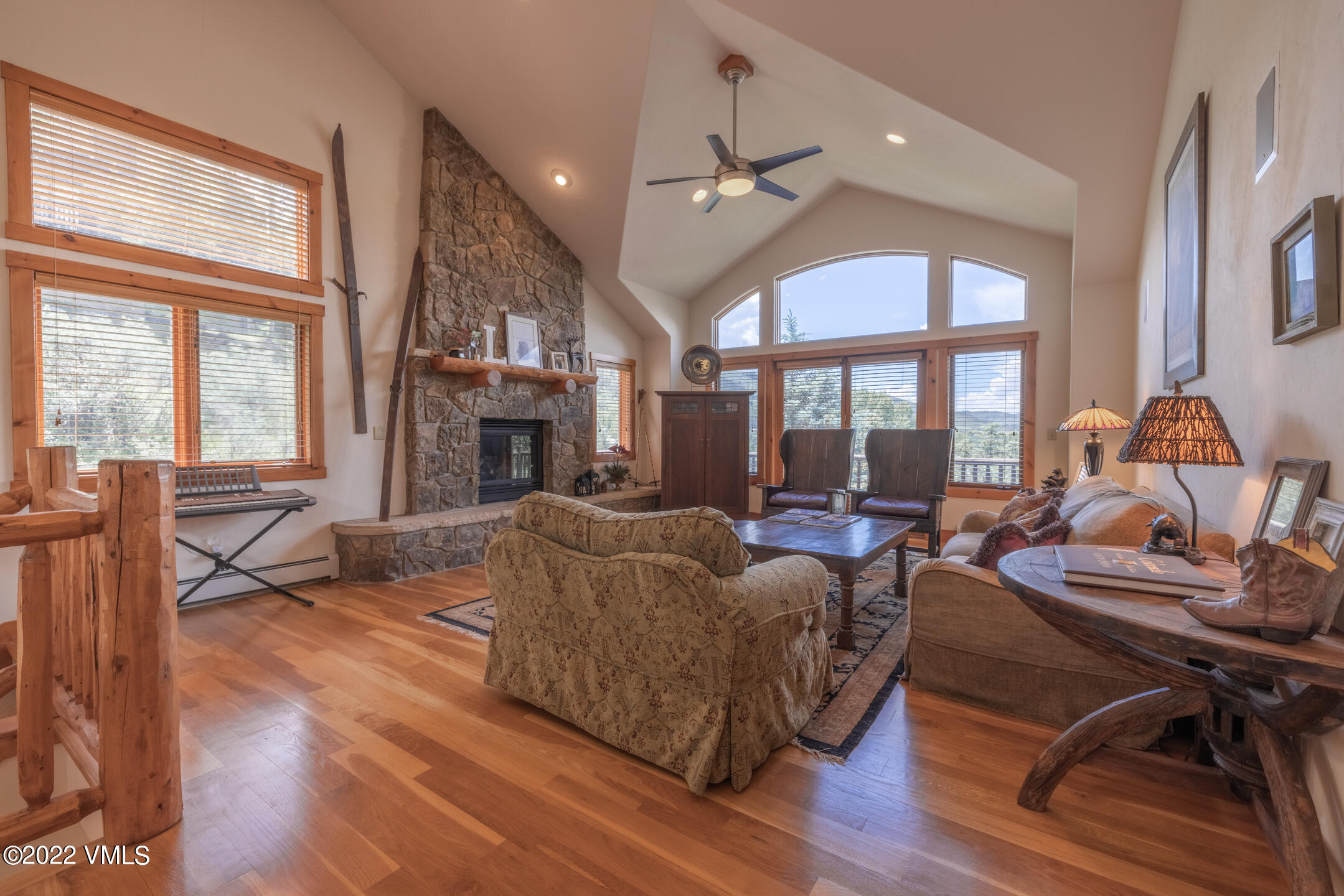 53 Knudson Ranch Road Edwards, CO 81632 - Photo 5 of 19 a living room with furniture fireplace and floor to ceiling windows