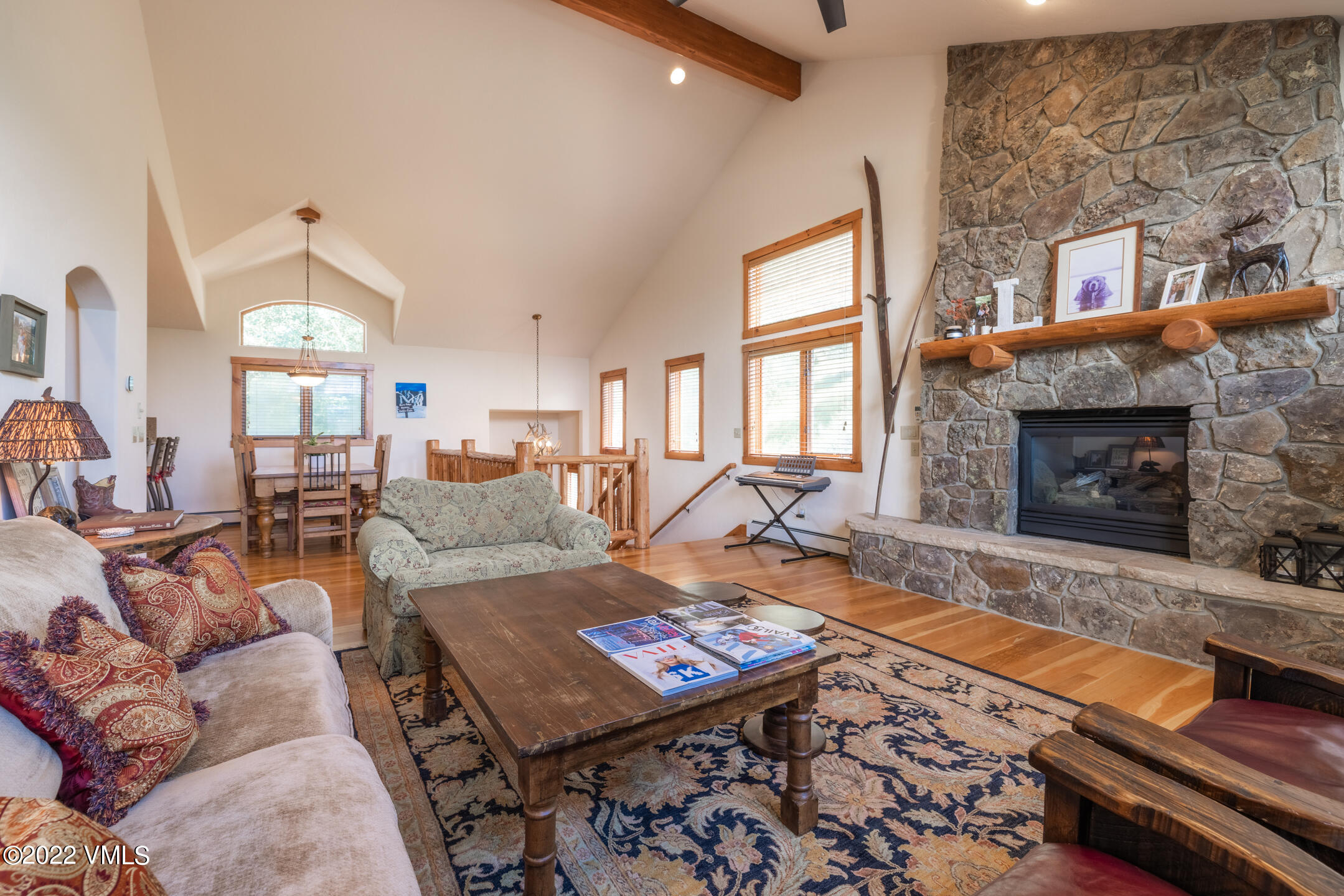 53 Knudson Ranch Road Edwards, CO 81632 - Photo 6 of 19 a living room with furniture a fireplace and a flat screen tv
