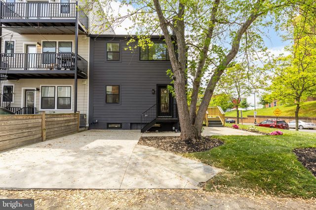 a backyard of a house with oven and garden