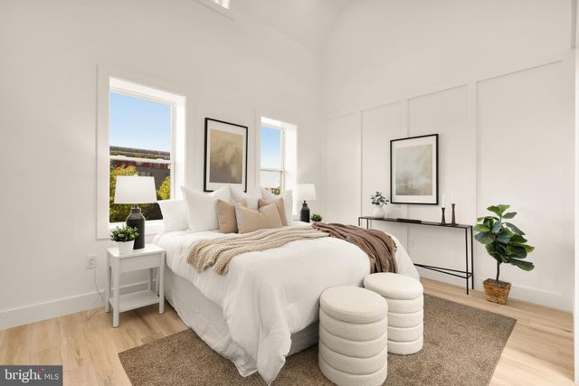 a spacious bedroom with a bed and window