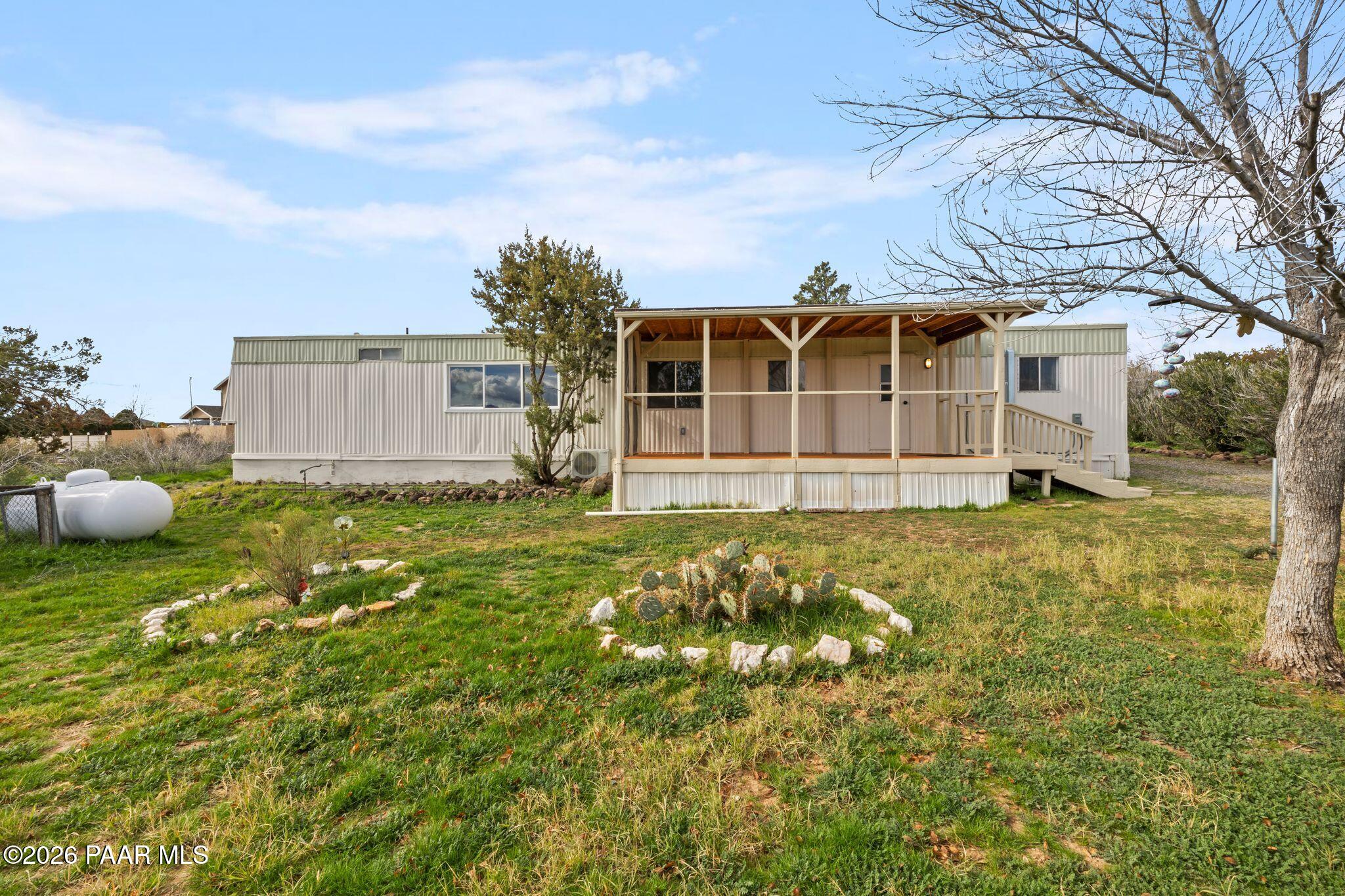 15455 South Rolling Ridge Drive Mayer, AZ 86333 - Photo 16 of 17 a front view of a house with garden
