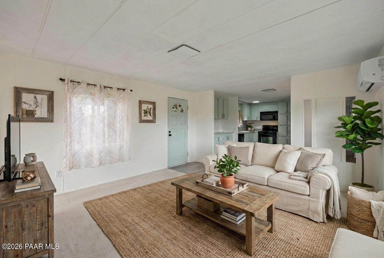 15455 South Rolling Ridge Drive Mayer, AZ 86333 - Photo 4 of 17 a living room with furniture and a table