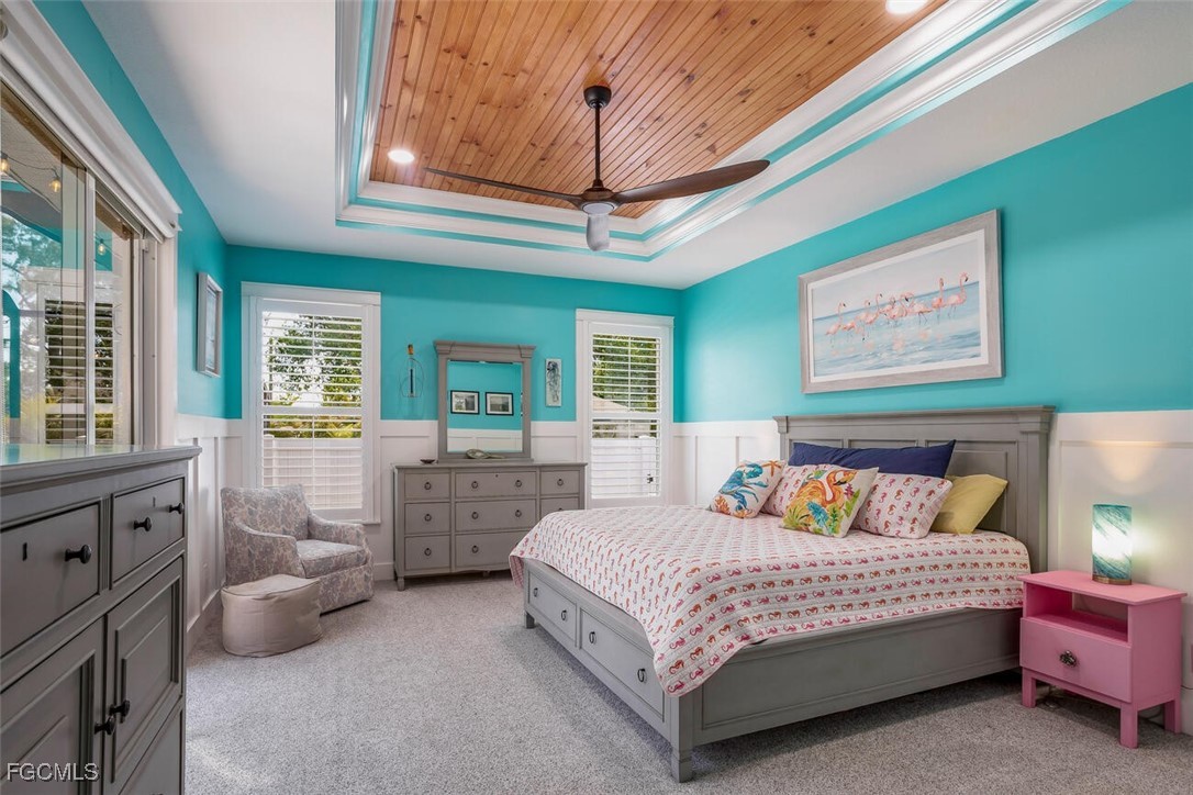 139 Crevalle Road Rotonda West, FL 33947 - Photo 12 of 24 a bedroom with furniture and a chandelier