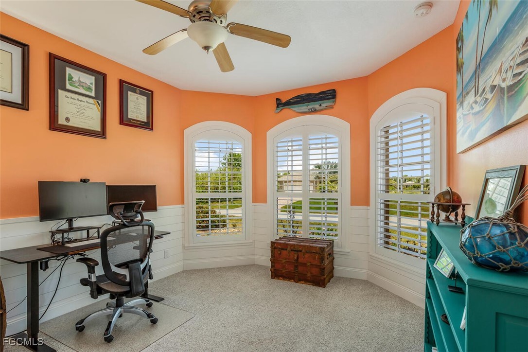 139 Crevalle Road Rotonda West, FL 33947 - Photo 15 of 24 a view of a livingroom with workspace and a window