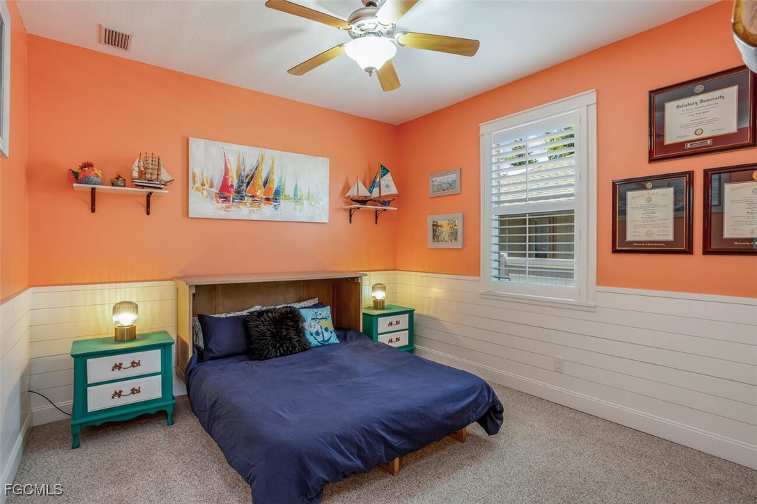 139 Crevalle Road Rotonda West, FL 33947 - Photo 16 of 24 a bedroom with a bed and a window
