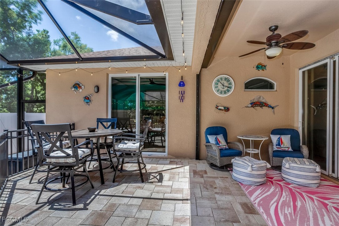 139 Crevalle Road Rotonda West, FL 33947 - Photo 19 of 24 a view of a patio with table and chairs