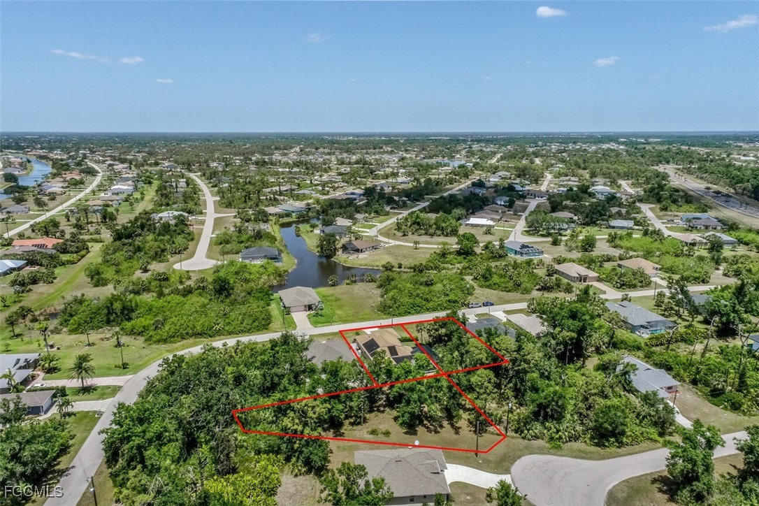 139 Crevalle Road Rotonda West, FL 33947 - Photo 20 of 24 an aerial view of residential building and green space