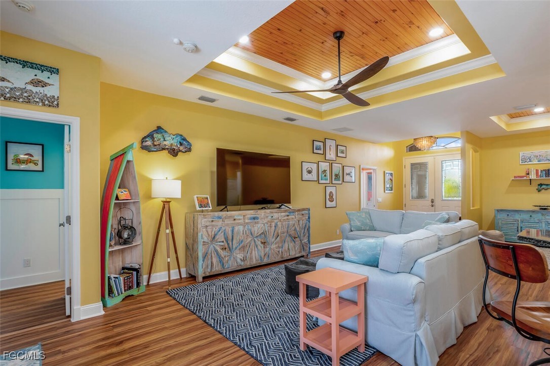 139 Crevalle Road Rotonda West, FL 33947 - Photo 10 of 24 a living room with furniture and a flat screen tv