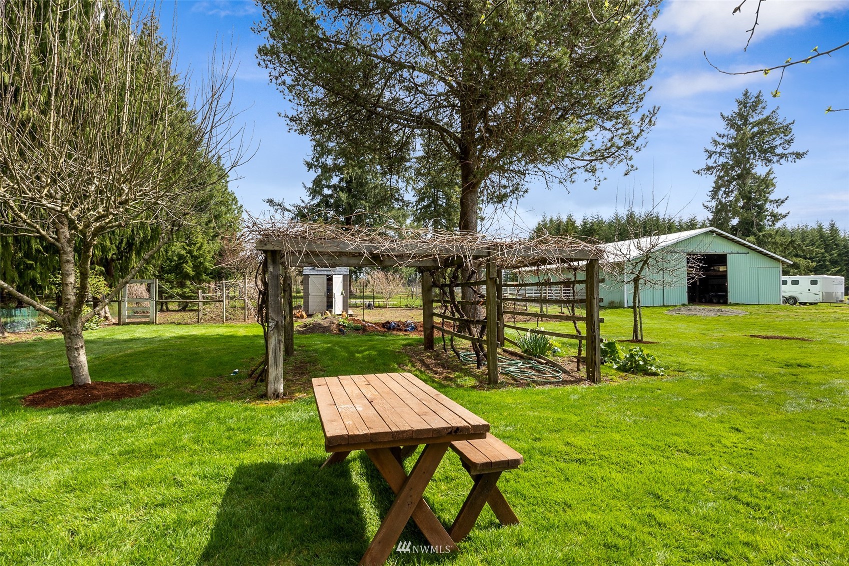 1096 North Military Road Winlock, WA 98596 - Photo 33 of 40 a view of a house with backyard and a tree