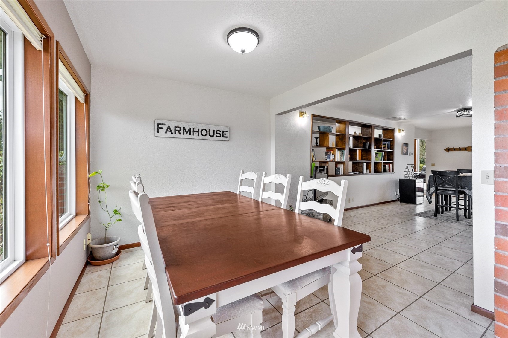 1096 North Military Road Winlock, WA 98596 - Photo 5 of 40 a view of a dining room with furniture and a potted plant