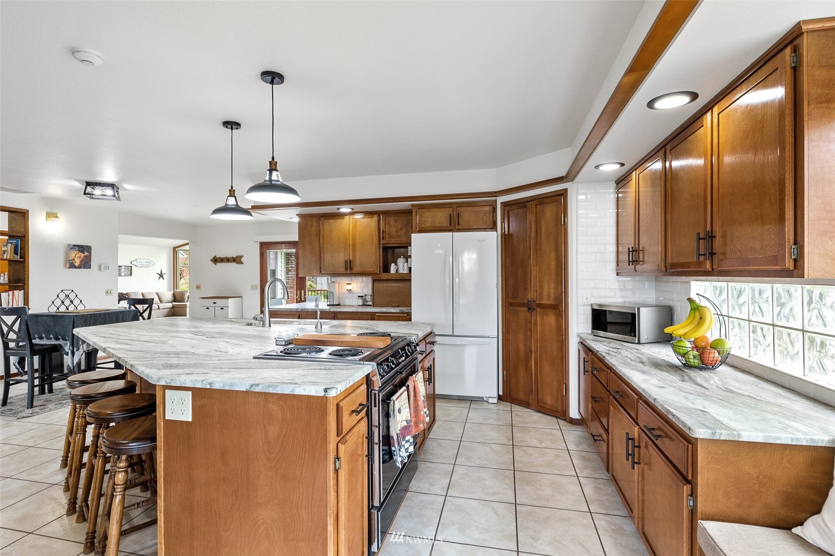 1096 North Military Road Winlock, WA 98596 - Photo 7 of 40 a kitchen with stainless steel appliances granite countertop a sink a counter space and stainless steel appliances