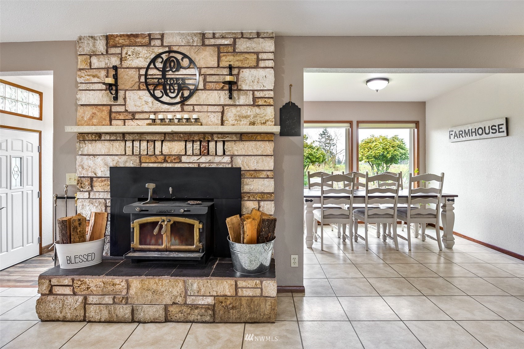 1096 North Military Road Winlock, WA 98596 - Photo 10 of 40 a dining room with fireplace furniture and a window