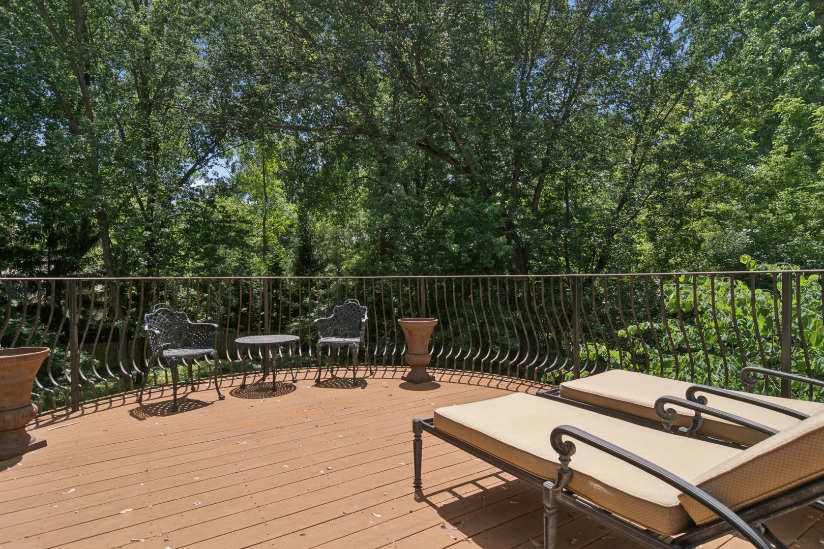 1128 Mt Pleasant Road Winnetka, IL 60093 - Photo 30 of 58 a balcony with wooden floor table and chairs