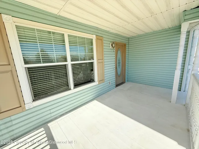 a view of a balcony with door