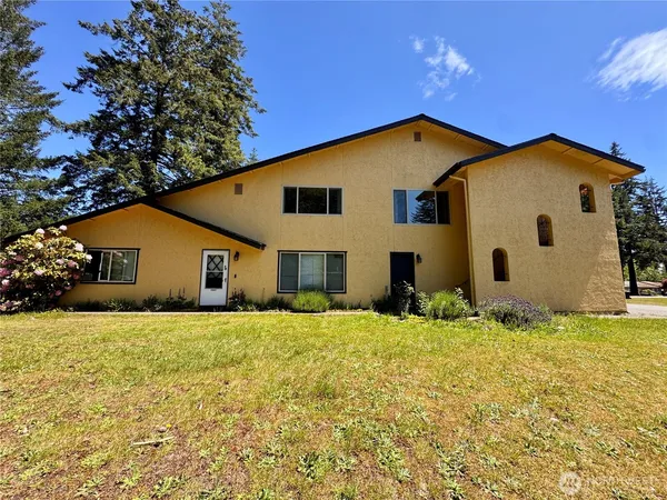 a house with yard in front of it