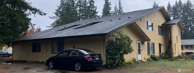 a car parked in front of a house