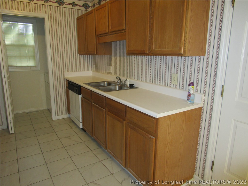 800 Turkey Ridge Drive Fayetteville, NC 28314 - Photo 11 of 23 a kitchen with a sink cabinets and appliances