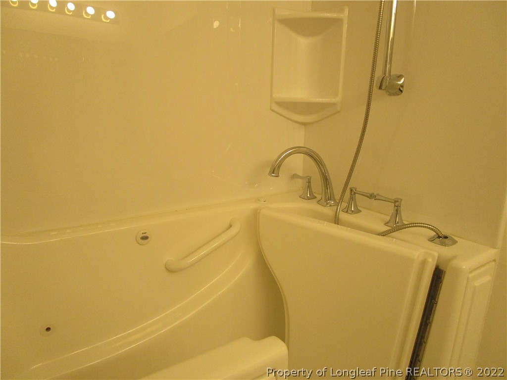 800 Turkey Ridge Drive Fayetteville, NC 28314 - Photo 18 of 23 a bathroom with a sink and a shower