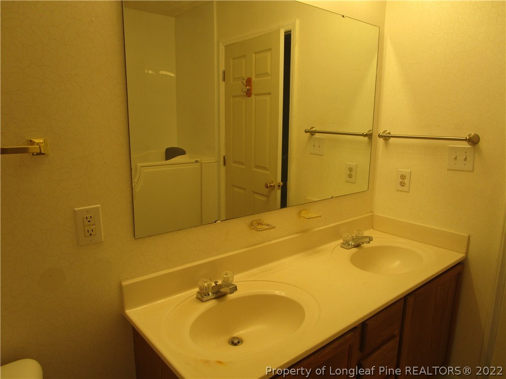800 Turkey Ridge Drive Fayetteville, NC 28314 - Photo 20 of 23 a bathroom with a sink and a shower