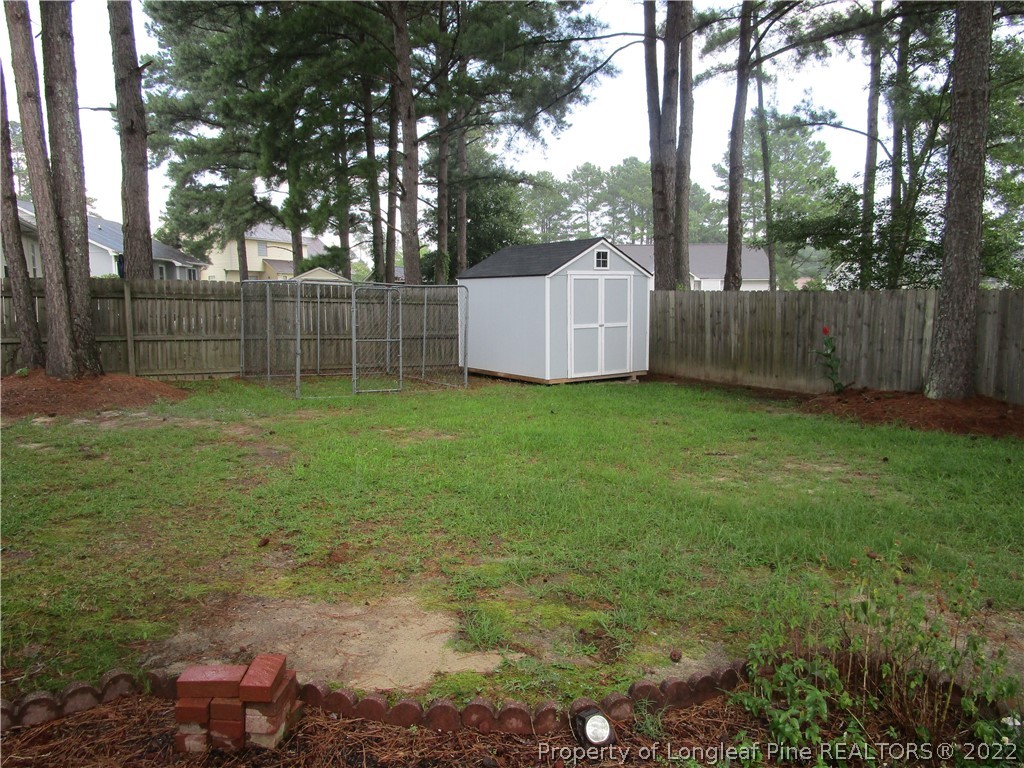 800 Turkey Ridge Drive Fayetteville, NC 28314 - Photo 3 of 23 a backyard of a house with lots of green space