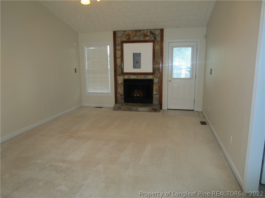 800 Turkey Ridge Drive Fayetteville, NC 28314 - Photo 8 of 23 a view of an empty room with a fireplace
