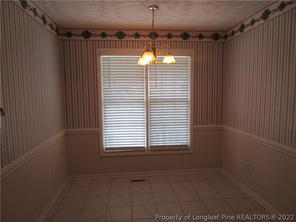 800 Turkey Ridge Drive Fayetteville, NC 28314 - Photo 10 of 23 a view of an empty room with a window