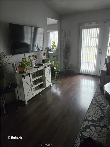 a view of livingroom with furniture wooden floor and window