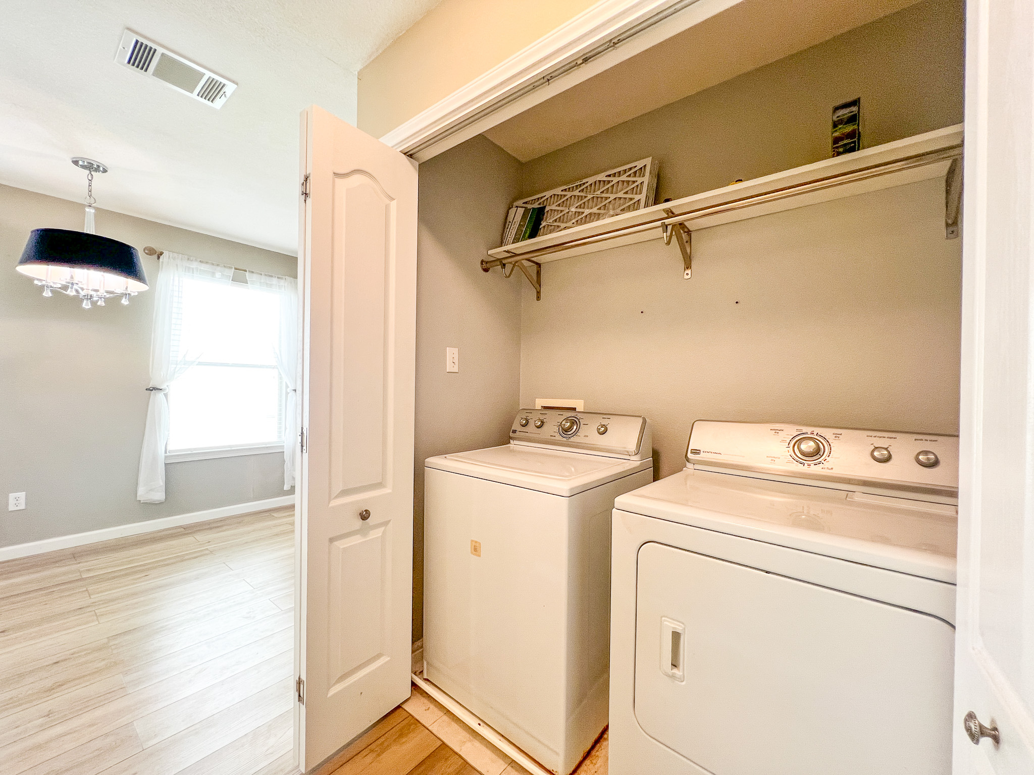 298 Jack Rabbit Lane Buda, TX 78610 - Photo 4 of 24 Functional laundry appliances neatly housed within a dedicated closet, offering convenience and organization.