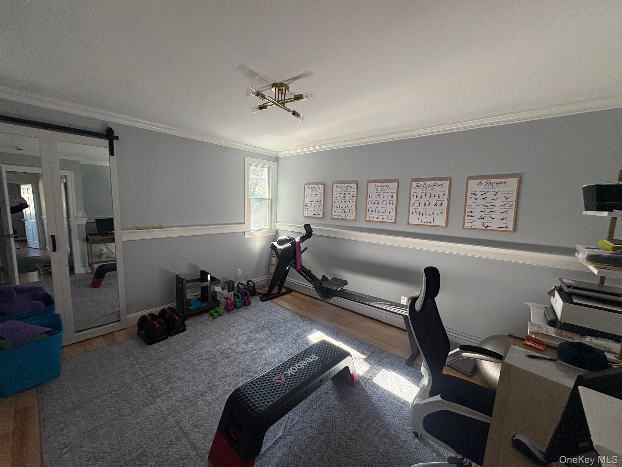 5270 Nassau Point Road Cutchogue, NY 11935 - Photo 14 of 25 a room with furniture closet and wooden floor