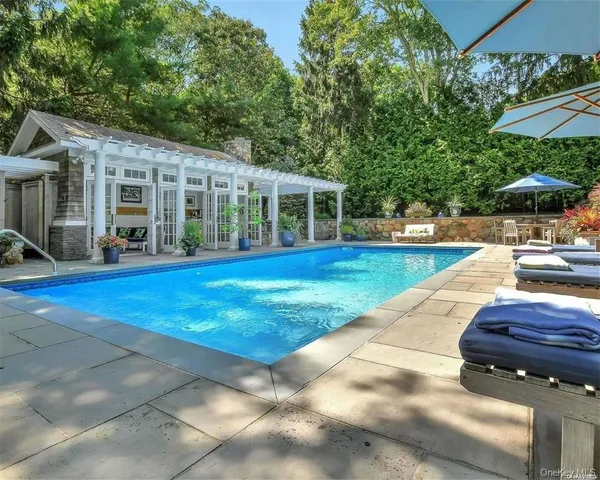 a view of a house with sitting area and garden