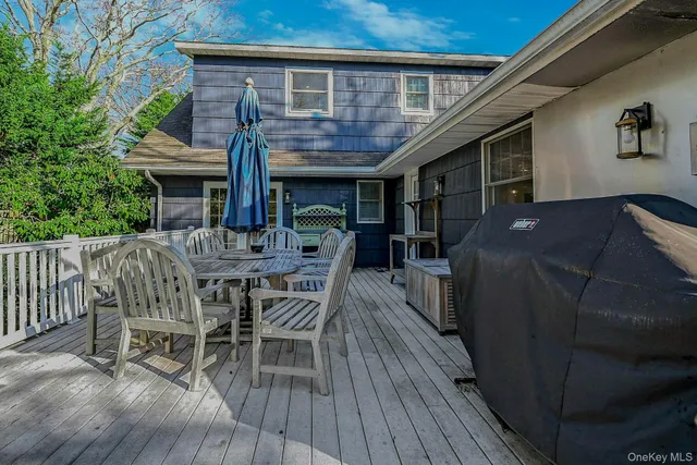 a view of house with patio outdoor seating and wooden floor